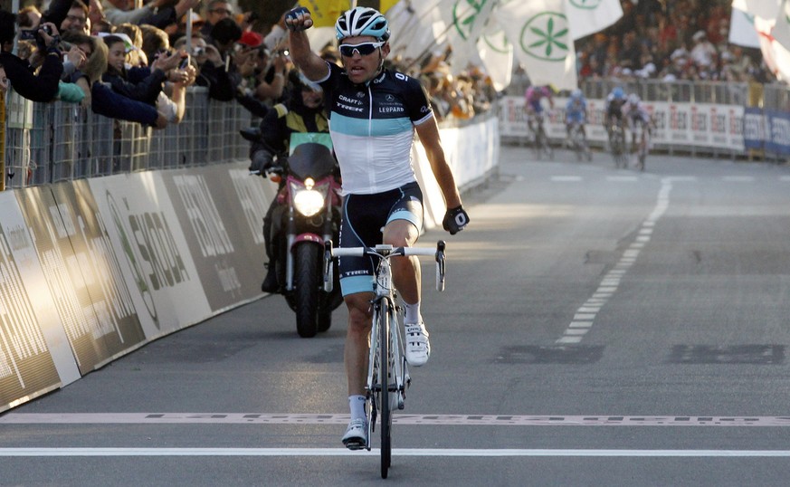Oliver Zaugg of Switzerland celebrates as he crosses the finish line to win the Tour of Lombardy cycling race in Lecco, Italy, Saturday, Oct.15, 2011. (AP Photo/Luca Bruno)