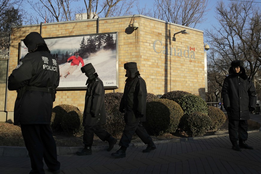 FILE - In this Dec. 12, 2018, file photo, policemen patrol outside the Canadian Embassy in Beijing. China on Thursday, Sept. 5, 2019, has urged Canada to &quot;reflect on its mistakes&quot; and immedi ...