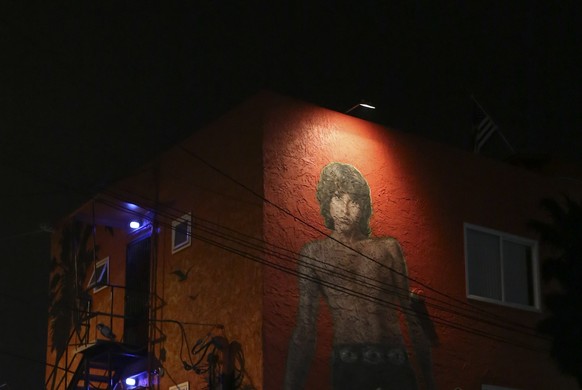 epa07202169 (FILE) - A mural of the late musician Jim Morrison of The Doors classic rock band attracts fans after the &#039;Day of The Doors&#039; ceremony in Venice, California USA, 04 January 2017 ( ...