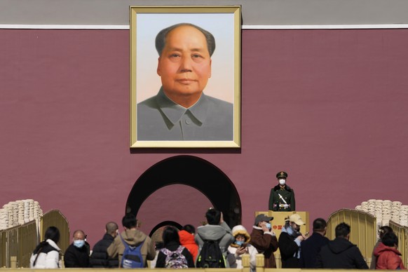 A Chinese paramilitary policeman stands guard near a portrait of late Chinese leader Mao Zedong on Tiananmen Gate ahead of the National People&#039;s Congress in Beijing, Wednesday, March 1, 2023. The ...