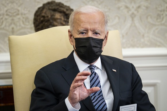 epa09133540 US President Joe Biden speaks to the media during a meeting with the Congressional Black Caucus in the Oval Office at the White House in Washington, DC, USA, on 13 April 2021. Vice Preside ...