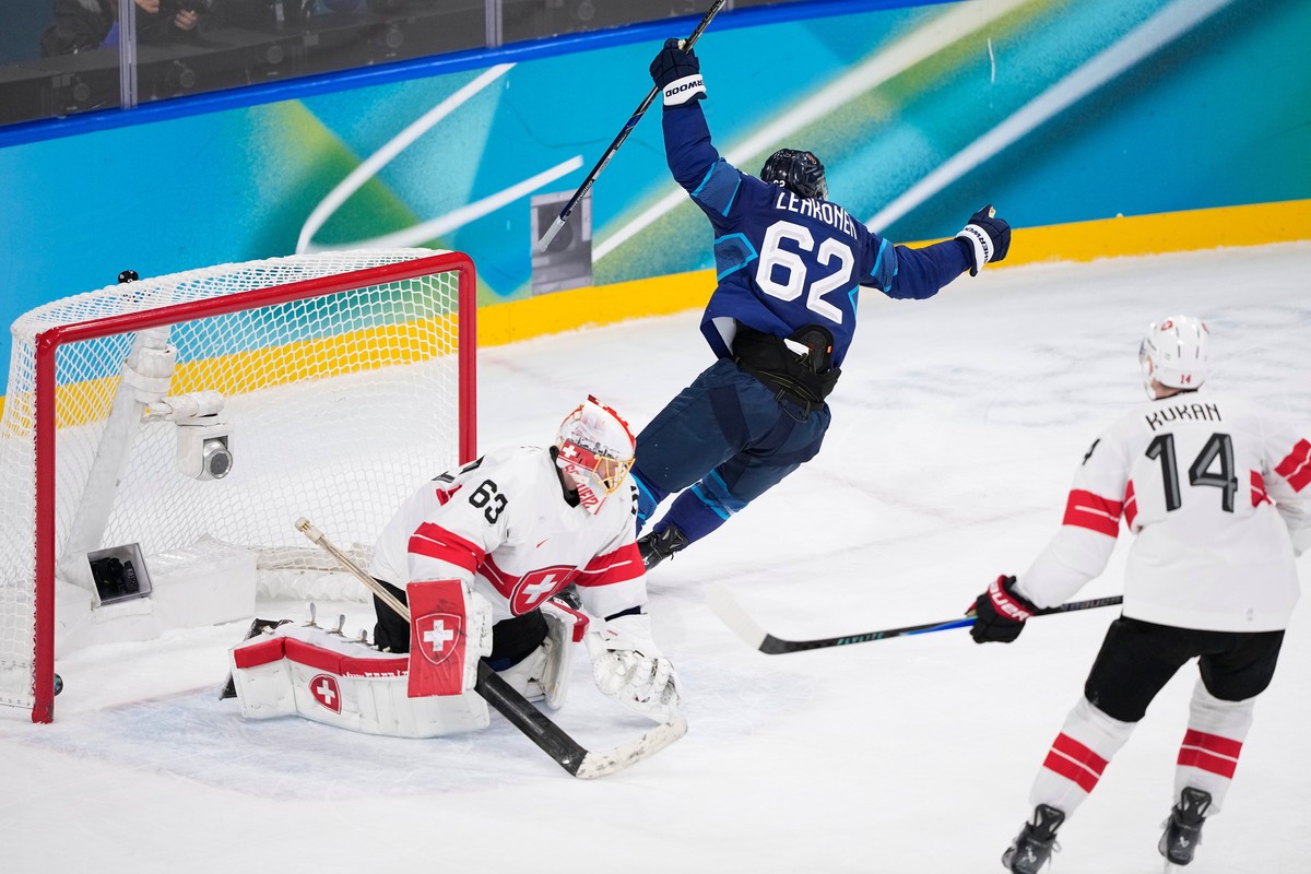 Finland's Artturi Lehkonen (62) scores his side's third goal during a men's ice hockey quarterfinal game between Finland and Switzerland at the 2026 Winter Olympics, in Milan, Italy, We ...