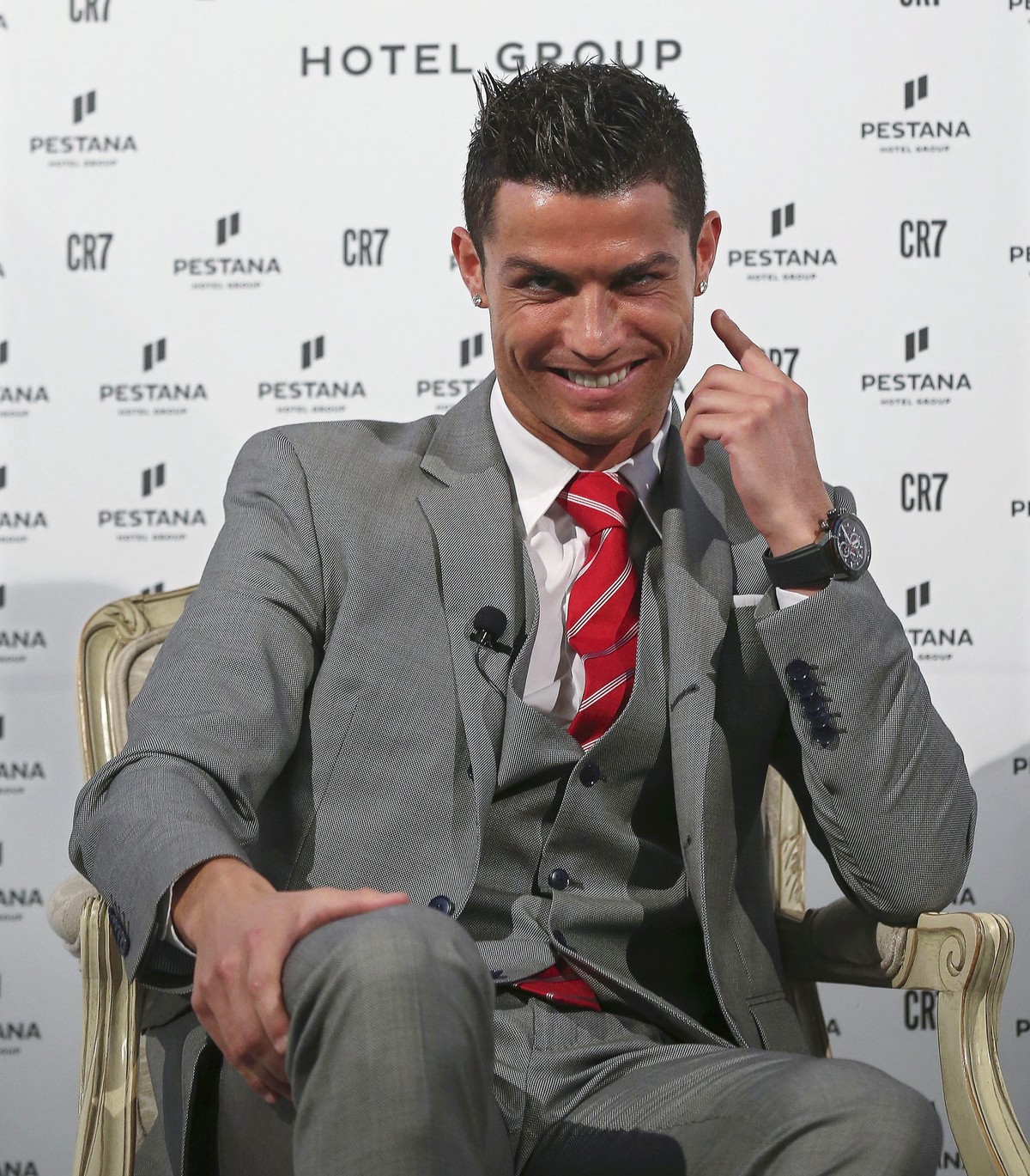 epa05073208 Real Madrid's Portuguese striker Cristiano Ronaldo smiles during the presentation of an agreement with the Pestana Hotel Group, planning to build four hotels, at Pestana Palace Hotel  ...