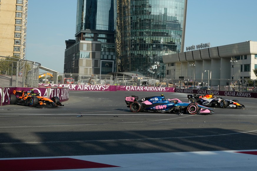 Alpine driver Franco Colapinto of Argentina, center, crashes with McLaren driver Lando Norris of Britain, left, and Racing Bulls driver Liam Lawson of New Zealand during the Azerbaijan F1 Grand Prix a ...