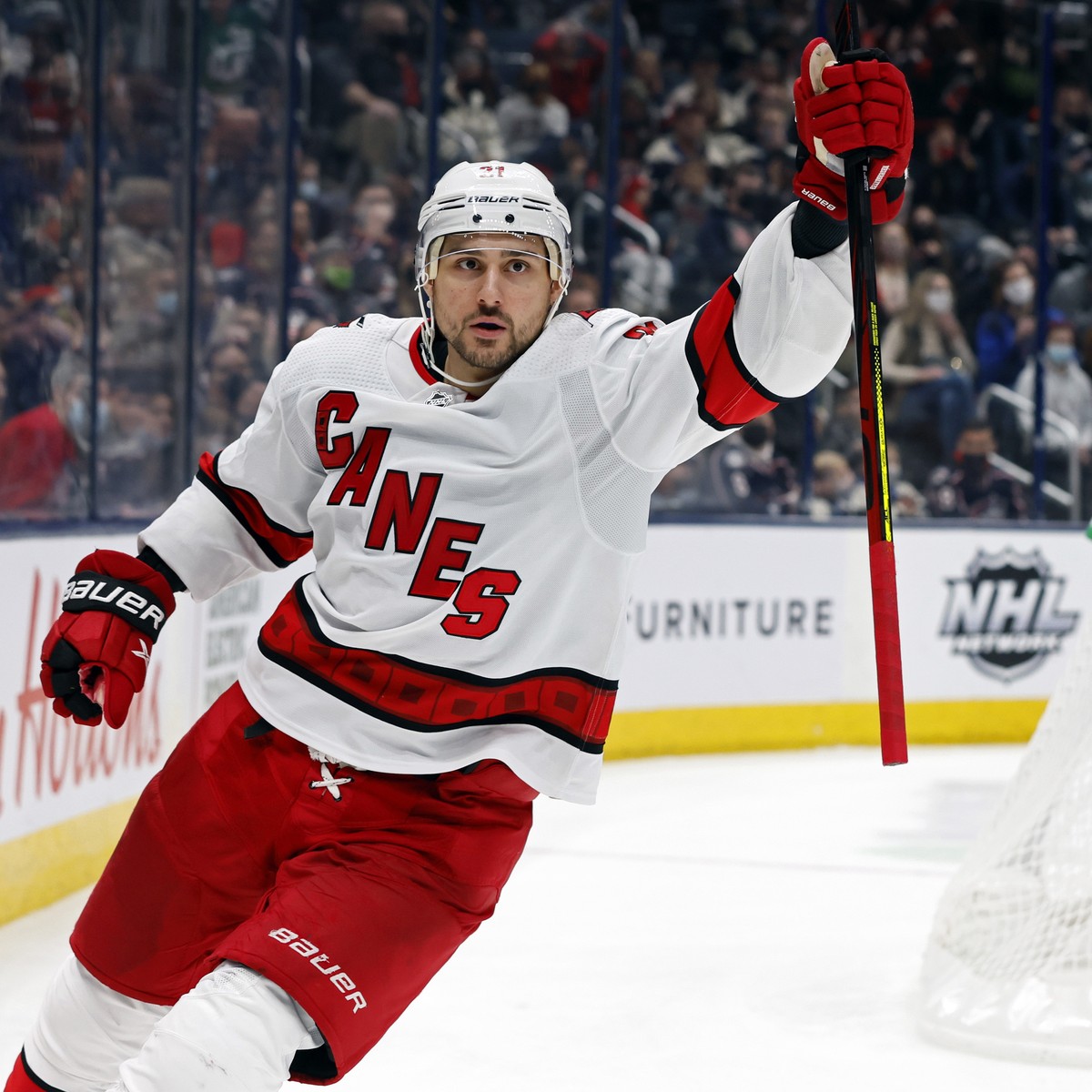 Carolina Hurricanes' Nino Niederreiter, left, celebrates his goal against Columbus Blue Jackets' Elvis Merzlikins during the third period of an NHL hockey game Saturday, Jan. 1, 2022, in Col ...