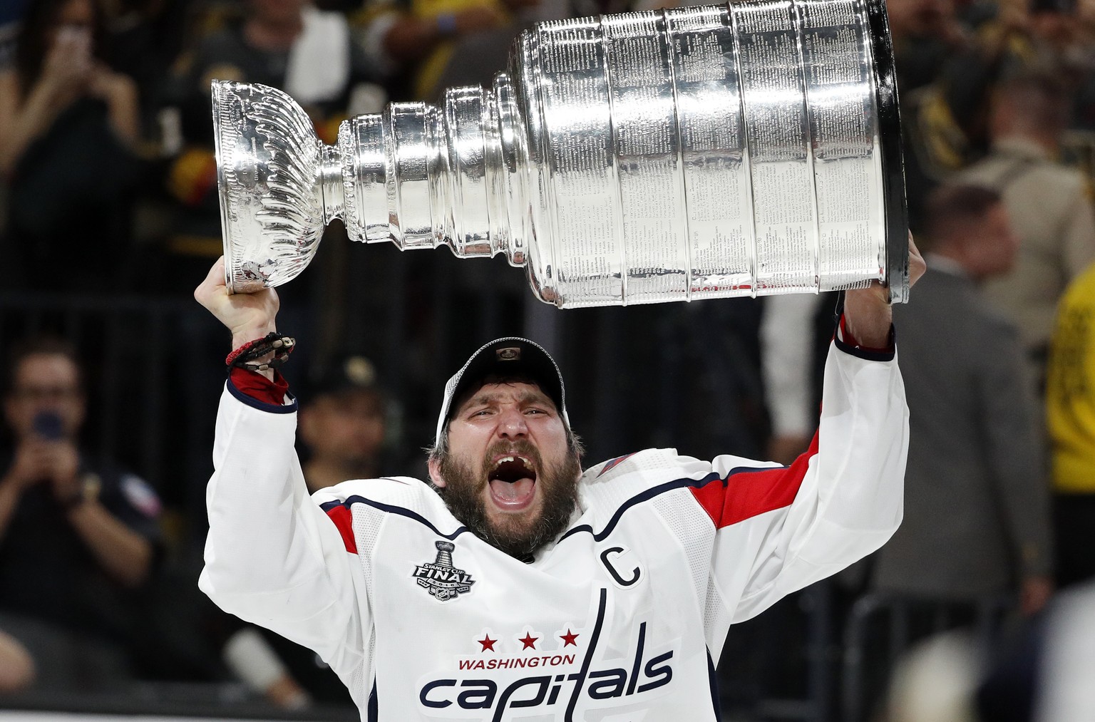FILE - In this June 7, 2018, file photo, Washington Capitals left wing Alex Ovechkin, of Russia, hoists the Stanley Cup after the Capitals defeated the Golden Knights in Game 5 of the NHL hockey Stanl ...