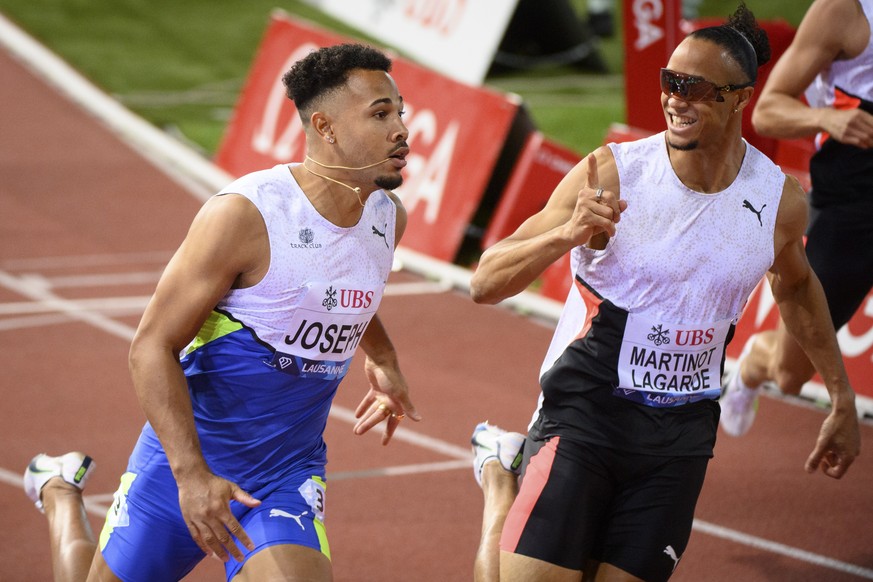 epa09431127 Jason Joseph, left, of Switzerland and Pascal Martinot-Lagarde, right, of France react after crossing the finish line of the 110m Hurdles Men at the Athletissima IAAF Diamond League intern ...
