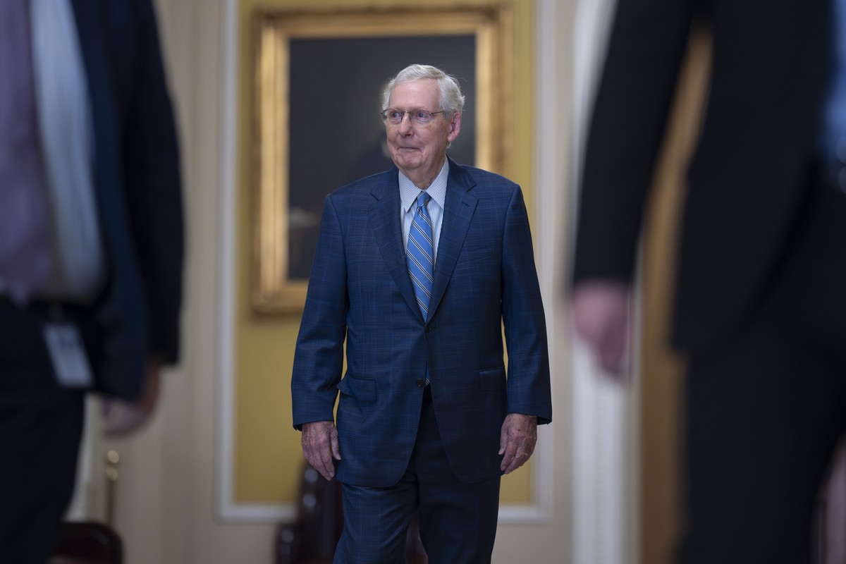 Senate Minority Leader Mitch McConnell, R-Ky., smiles as he walks to join other Republicans who will vote to replace him with a new leader, at the Capitol in Washington, Wednesday, Nov. 13, 2024. (AP  ...