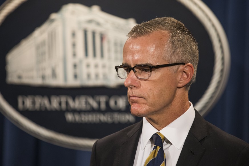 epa06484280 (FILE) Acting FBI Director Andrew McCabe, waits to speak at a press conference to announce the results from the Justice Department's annual national health care fraud takedown at the Depar ...