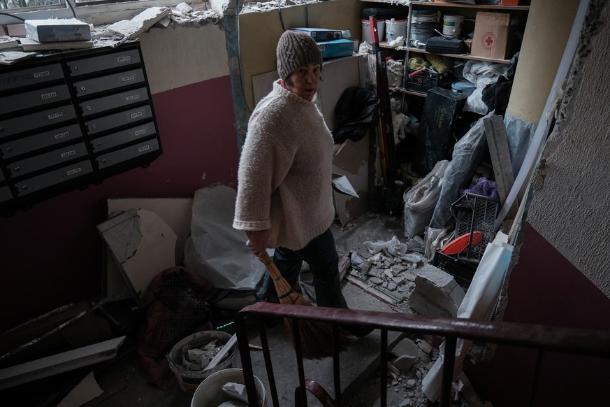 epa12717207 A person surveys the damage following the Russian bombing of a residential neighbourhood in Kramatorsk (Donetsk Oblast) on 08 February 2026 The attack occurred at 5 a.m. local time with th ...