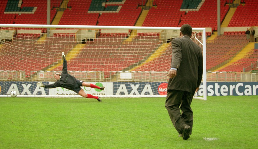 31 Oct 2000: Pele scores past Gordon Banks during an AXA photocall at Wembley in London. \ Mandatory Credit: Clive Mason /Allsport