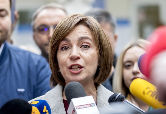 epa11670773 President of Moldova Maia Sandu speaks to media after voting in front of polling station in Chisinau, Moldova, 20 October 2024. Moldova holds presidential election and a referendum on whet ...