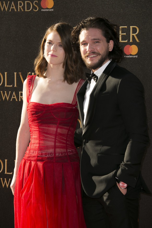 Kit Harington, right, and Rose Leslie pose for photographers as they arrive for the Olivier Awards at the Royal Albert Hall in central London, Sunday, April 9, 2017. (Photo by Joel Ryan/Invision/AP)