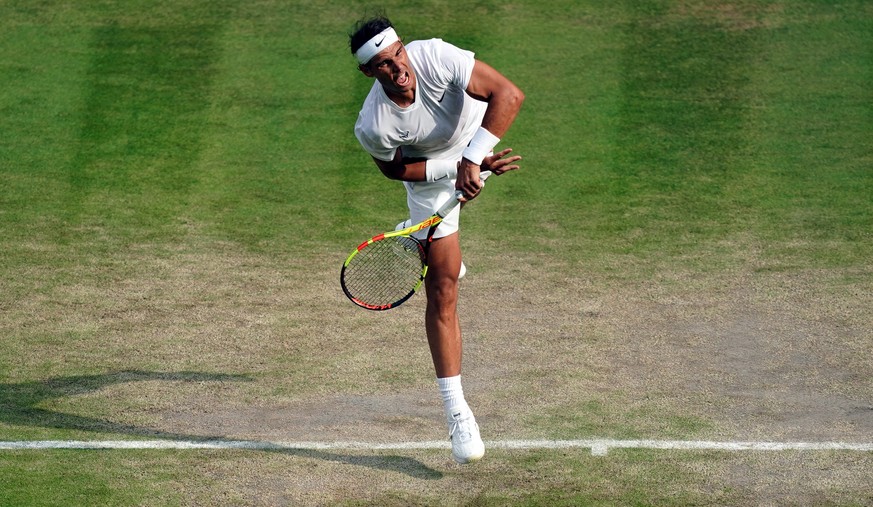 epa07708348 Rafael Nadal of Spain serves to Sam Querrey of the US in their quarter final match during the Wimbledon Championships at the All England Lawn Tennis Club, in London, Britain, 10 July 2019. ...