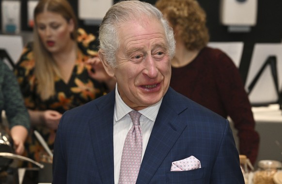 Britain's King Charles III visits the kitchen at the headquarters of cereal producer Kellogg's to mark his 100th birthday in Manchester, England, Friday, January 20, 2023. (Paul Ellis/Pool via ...