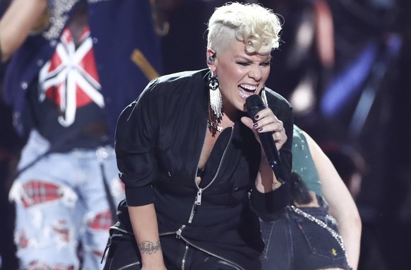 FILE - In this Sept. 22, 2017, file photo, Pink performs at the 2017 iHeartRadio Music Festival Day 1 held at T-Mobile Arena in Las Vegas. Pink is joining the list of stars performing in Minneapolis d ...