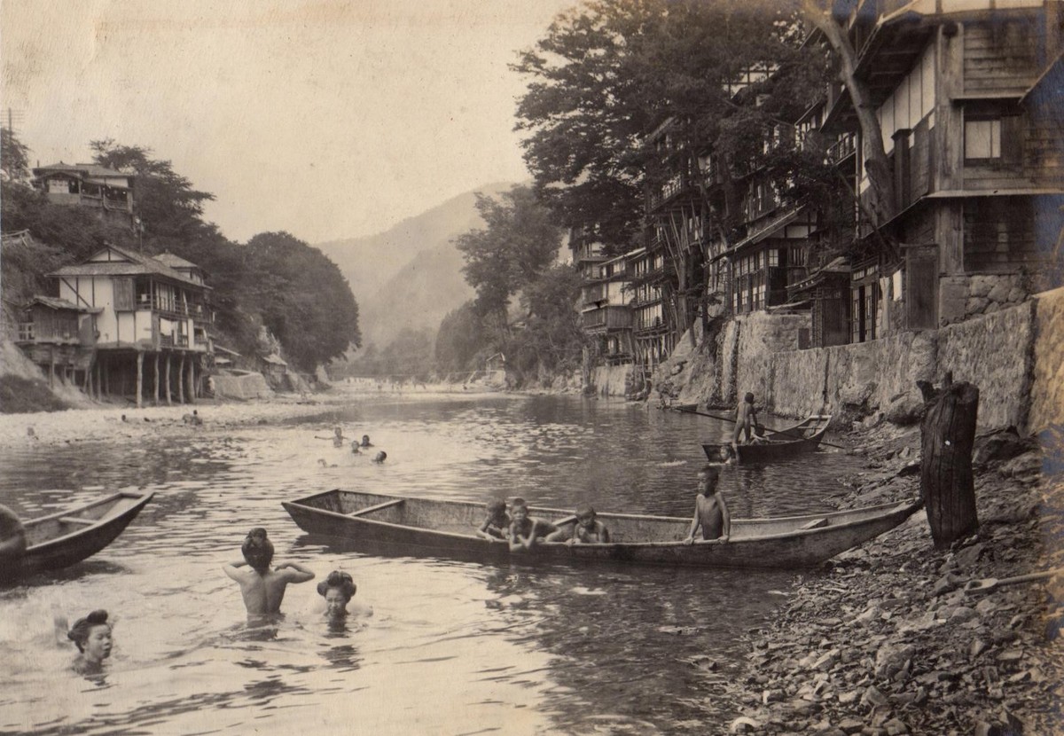 People bathing in a river during the summer. Japan, 1915