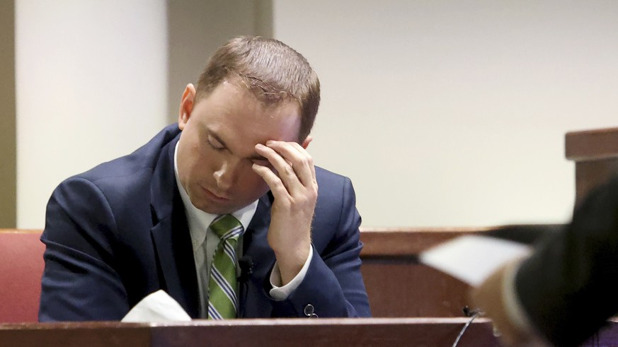 Defendant Aaron Dean reacts while while being cross examined by Assistant Tarrant County Criminal District Attorney Dale Smith on Monday, Dec. 12, 2022, in Fort Worth, Texas. Dean, a former Fort Worth ...