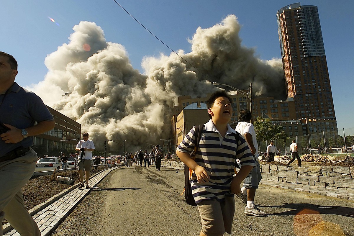 September 11 Retrospective
NEW YORK - SEPTEMBER 11, 2001: (PUERTO RICO OUT) (SEPTEMBER 11 RETROSPECTIVE) People run away as the North Tower of World Trade Center collapses after a hijacked airliner hi ...