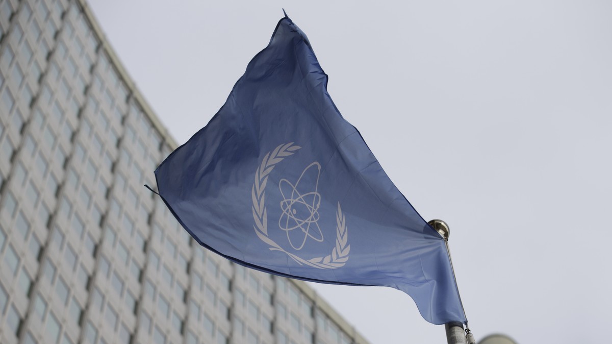FILE - The flag of the International Atomic Energy Agency flies in front of its headquarters during an IAEA Board of Governors meeting in Vienna, Austria, on Feb. 6, 2023. Diplomats say the U.N. nucle ...