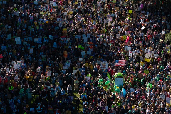 People gather along a waterfront park during a &quot;No Kings&quot; protest in Portland, Ore., on Saturday, Oct. 18, 2025. (AP Photo/Jenny Kane)
US Protests Portland