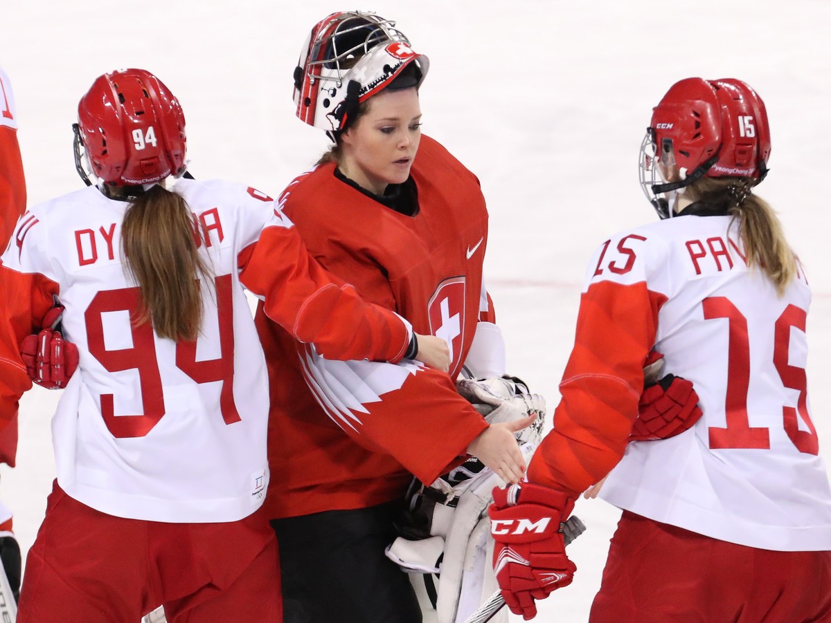 epa06535049 Goalie Florence Schelling (C) of Switzerland shakes hands with Yevgenia Dyupina (L), Valeria Pavlova (R) of OAR after women's quarterfinal match between Olympic Athletes from Russia ( ...