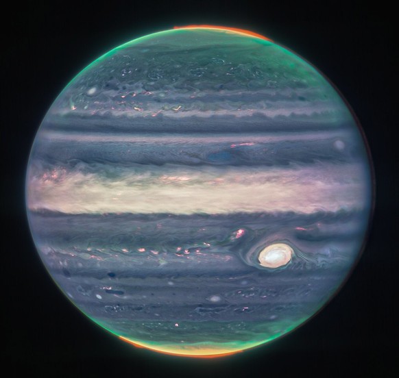 epa10134081 A handout photo made available by NASA shows a Webb NIRCam composite image of Jupiter from three filters and alignment due to the planet?s rotation, issued 22 August 2022. The image is a c ...