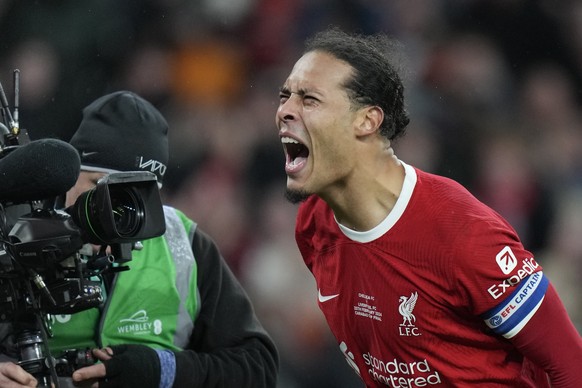 Liverpool&#039;s Virgil van Dijk celebrates after scoring his side&#039;s first goal during the English League Cup final soccer match between Chelsea and Liverpool at Wembley Stadium in London, Sunday ...