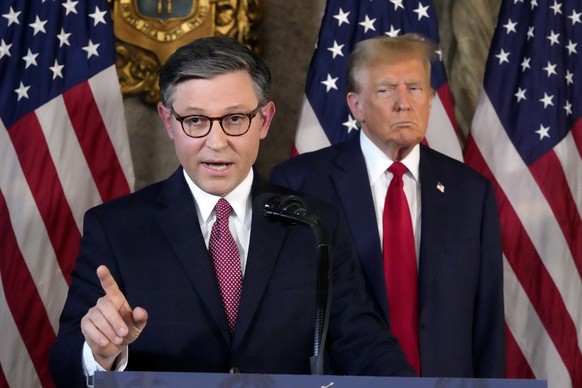 FILE - Speaker of the House Mike Johnson, R-La., speaks as Republican presidential candidate former President Donald Trump listens during a news conference, April 12, 2024, at Mar-a-Lago in Palm Beach ...