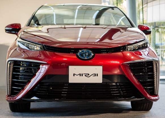 epa04493906 Toyota Motor Corporation's all-new fuel cell vehicle (FCV) sedan called 'Mirai' which means future in Japanese, is shown on display during an unveiling ceremony in Tokyo, Japan, 18 Novembe ...