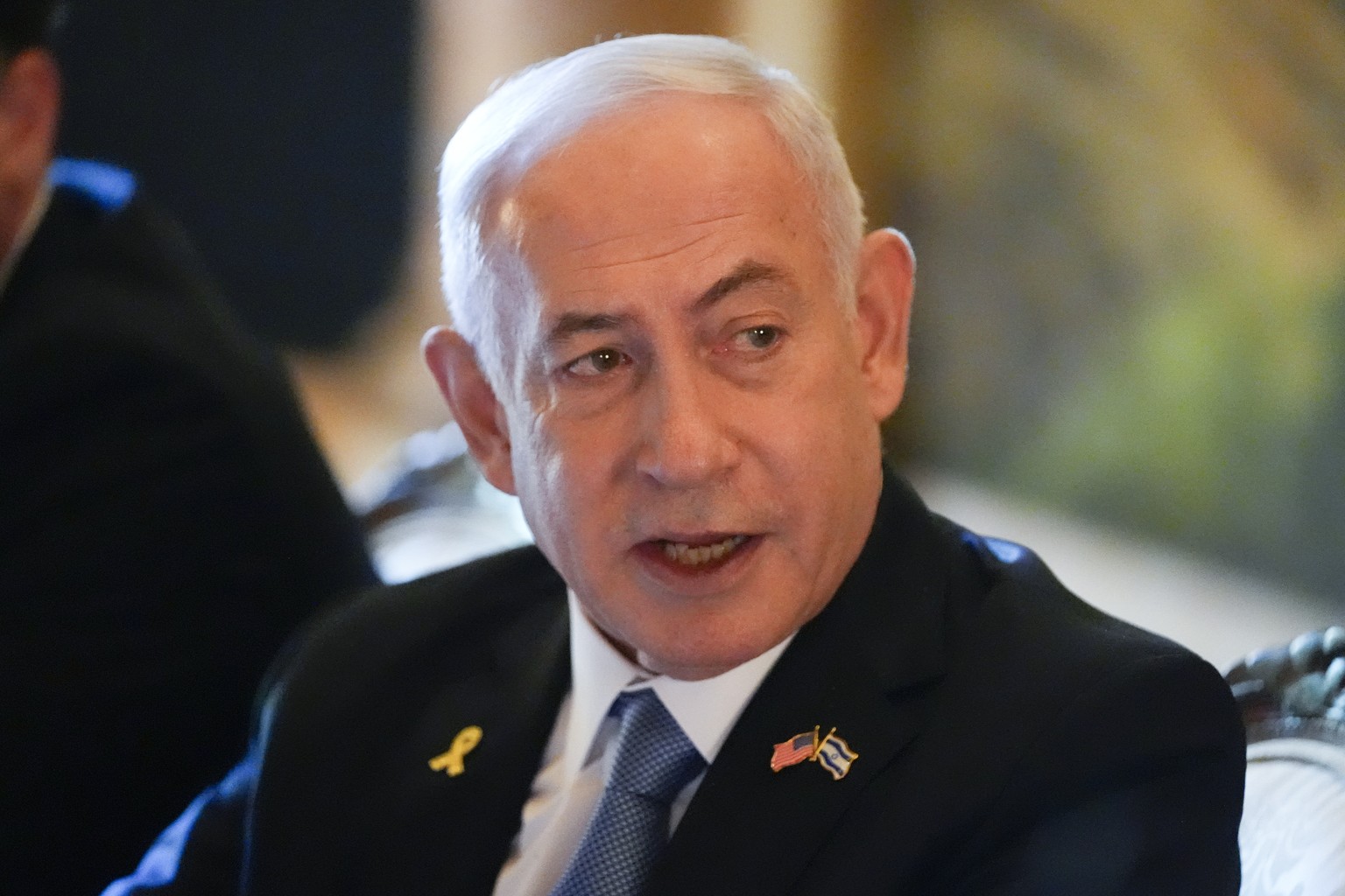 Israeli Prime Minister Benjamin Netanyahu speaks while meeting with Republican presidential candidate former President Donald Trump at his Mar-a-Lago estate, Friday, July 26, 2024, in Palm Beach, Fla. ...