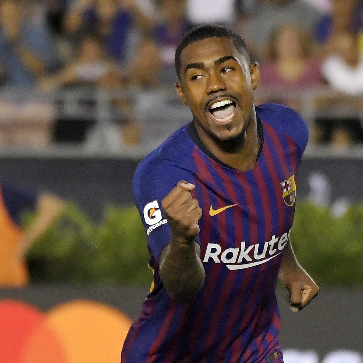 CORRECTS PLAYER'S NAME TO MALCOM INSTEAD OF CARLES ALENA - Barcelona midfielder Malcom celebrates his game-winning penalty kick during the shootout in an International Champions Cup tournament so ...