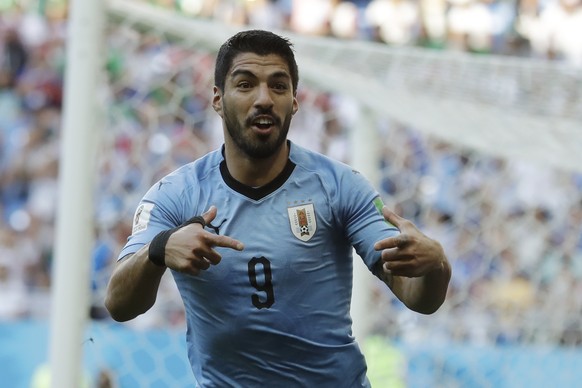 Uruguay's Luis Suarez celebrates scoring his side's first goal during the group A match against Saudi Arabia at the 2018 soccer World Cup in Rostov Arena in Rostov-on-Don, Russia, Wednesday, June 20,  ...