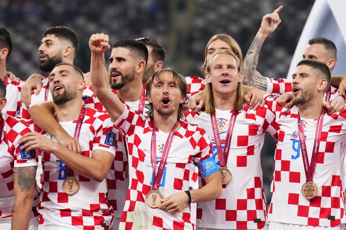 Croatia's players celebrate with their medals after the World Cup third-place playoff soccer match between Croatia and Morocco at Khalifa International Stadium in Doha, Qatar, Saturday, Dec. 17,  ...