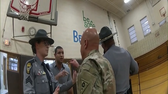 This photo provided by Ohio State Highway Patrol shows police bodycam footage of NewsNation correspondent Evan Lambert interaction with the leader of the Ohio National Guard Wednesday, Feb. 8, 2023 in ...