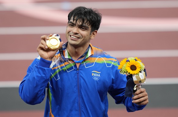 epa09403990 Gold medalist Neeraj Chopra of India during the medal ceremony for the Men&#039;s Javelin Throw final during the Athletics events of the Tokyo 2020 Olympic Games at the Olympic Stadium in  ...