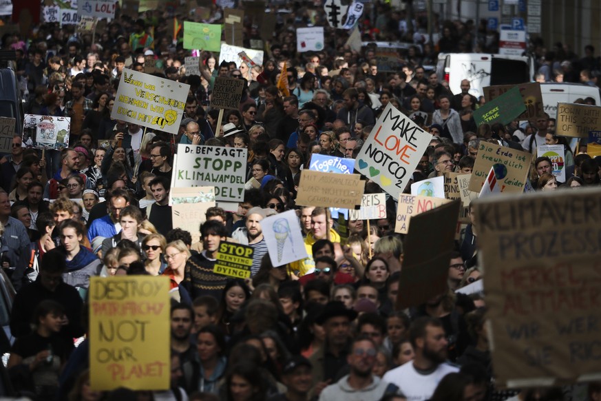 Demonstrators hold posters as they attend the &#039;Friday for Future&#039; climate protest near the Brandenburg Gate in Berlin, Germany, Friday, Sept. 20, 2019. Protests of the &#039;Fridays For Futu ...