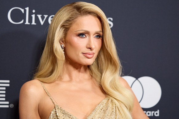 epa11125107 US media personality Paris Hilton arrives at the Pre-Grammy Gala at The Beverly Hilton in Beverly Hills, California, USA, 03 February 2024. The 66th Annual Grammy Awards honoring the best  ...