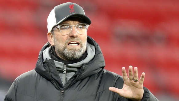 Liverpool's manager Jurgen Klopp gestures during the Champions League round of 16, first leg, soccer match between RB Leipzig and Liverpool at the Ferenc Puskas stadium in Budapest, Hungary, Tuesday,  ...