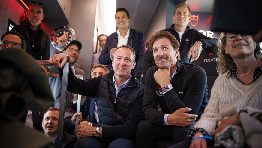 Former Swiss cyclist and team director Fabian Cancellara (right) watches a race with Tudor watches CEO Eric Pirson in the Tudor bus, during the second stage, a 162,7 km race between Morteau in France  ...