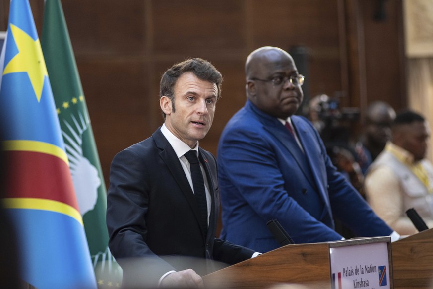 French President Emmanuel Macron, left, addresses the media during a joint press conference with Democratic Republic of Congo President Felix Tshisekedi in Kinshasa, Democratic Republic of Congo, Saturday...