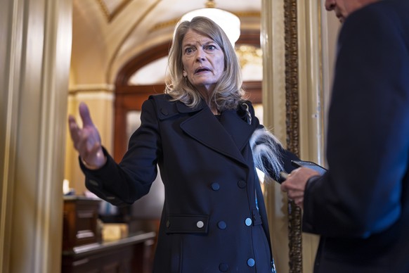 Sen. Lisa Murkowski, R-Alaska, a member of the Senate Appropriations Committee, pauses outside the chamber to answer a question from a reporter as the Senate works to avert a partial government shutdo ...