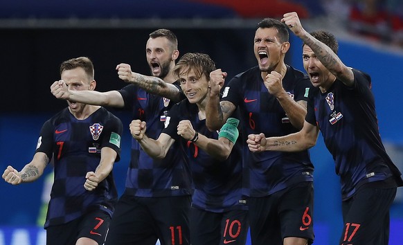 Croatia national soccer team players celebrate after a penalty is saved in a shootout during the quarterfinal match between Russia and Croatia at the 2018 soccer World Cup in the Fisht Stadium, in Soc ...