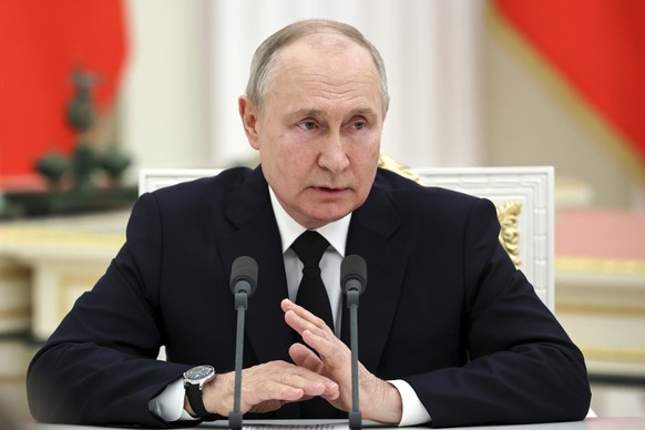 Russian President Vladimir Putin speaks as he meets with Russian servicemen at the Kremlin in Moscow, Russia, Tuesday, June 27, 2023. (Mikhail Tereshchenko, Sputnik, Kremlin Pool Photo via AP)