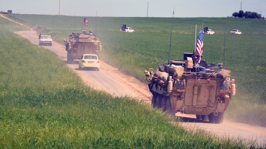 epa07240227 (FILE) - A convoy of US army troops and the People&#039;s Protection Units (YPG) Kurdish militia patrol near al-Ghanamya village, al-Darbasiyah town at the Syrian-Turkish border, Syria, 29 ...