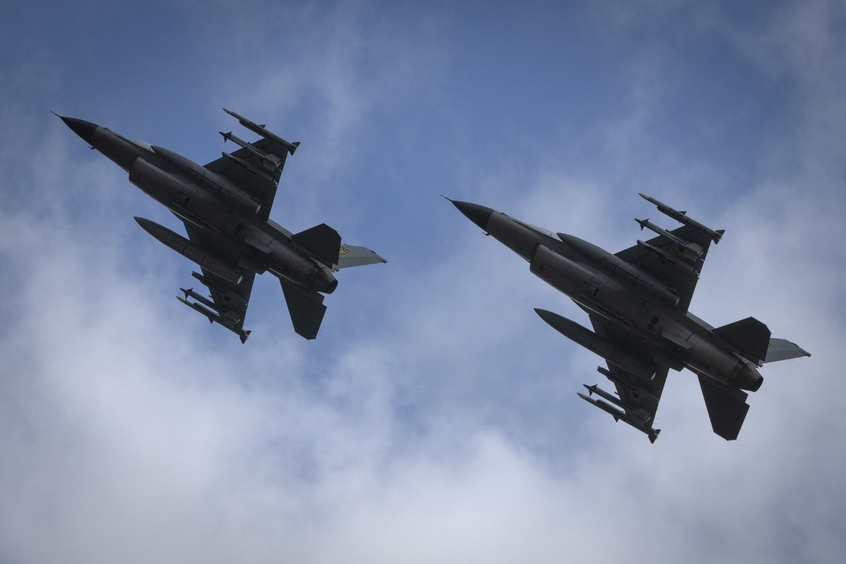 The Ukrainian Air Force's F-16 fighter jets fly in an undisclosed location in Ukraine, Sunday, Aug. 4, 2024. The F-16 fighter jets that have been delivered to Ukraine by Western countries will be ...