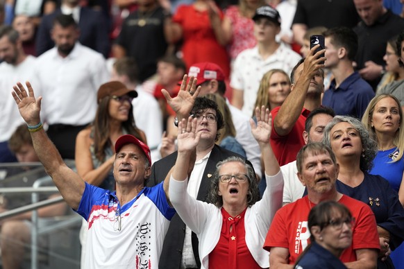People attend a memorial for conservative activist Charlie Kirk, Sunday, Sept. 21, 2025, at State Farm Stadium in Glendale, Ariz. (AP Photo/Julia Demaree Nikhinson)
Charlie Kirk Memorial