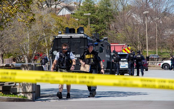 epa10545911 Metro Nashville Police Department and officials on the scene outside the Covenant School, Covenant Presbyterian Church, following a shooting in Nashville, Tennessee, USA, 27 March 2023. Me ...