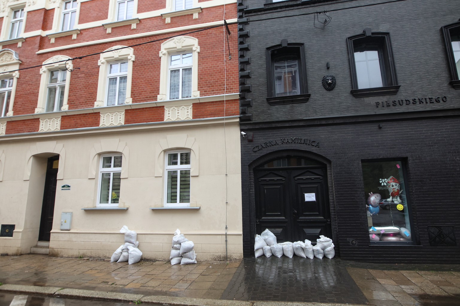 epa11603811 Barriers with sandbags against the flood water in Bytom, southern Poland, 14 September 2024. The Genoese low that reached Poland on Thursday, September 12, is responsible for the current b ...
