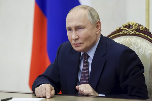 Russian President Vladimir Putin gesture during a meeting with winners of the Teacher of the Year in Russia competition the country&#039;s best teachers, school principals and mentors via videoconfere ...